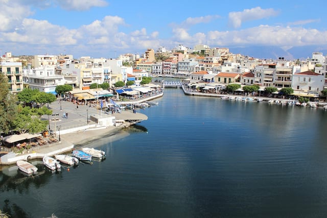 Boats moored in the ringed inner harbour at Agios Nikolaos.